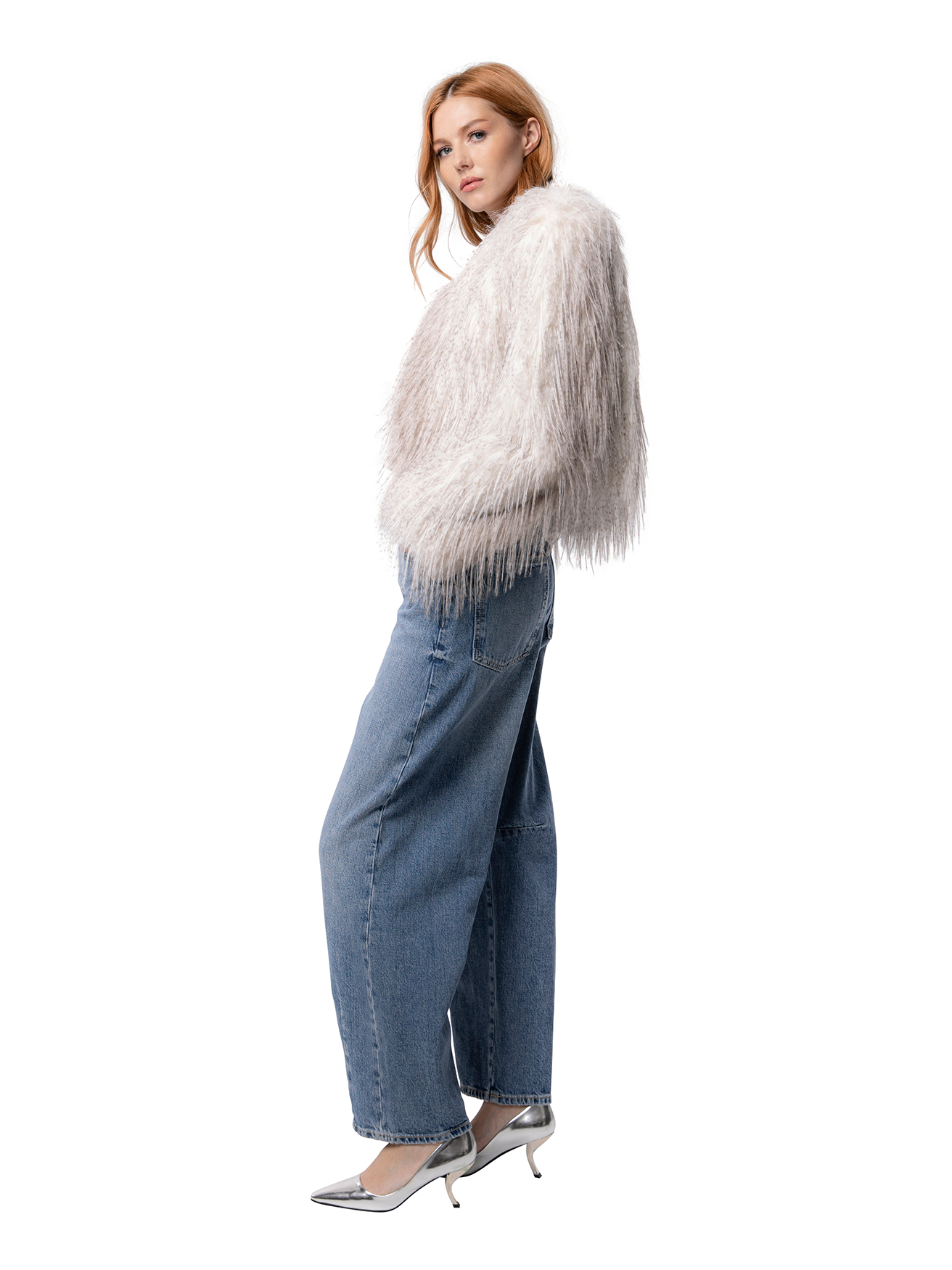 ANNA jacket in Cream Ostrich — side profile highlighting textured cruelty-free fur, short hemline, and front pocket.