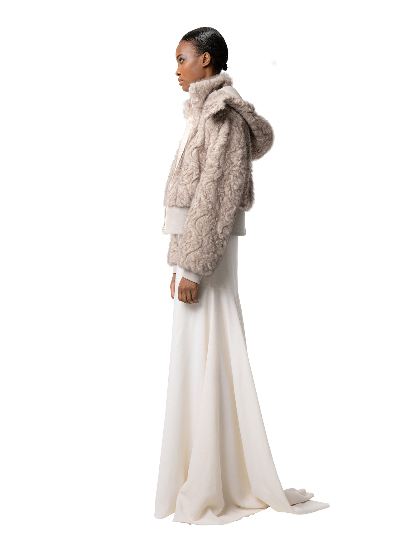 Side view — FIONA in Husky shown from the side, highlighting the plush cruelty-free fur, voluminous sleeves, and the relaxed hood drape.