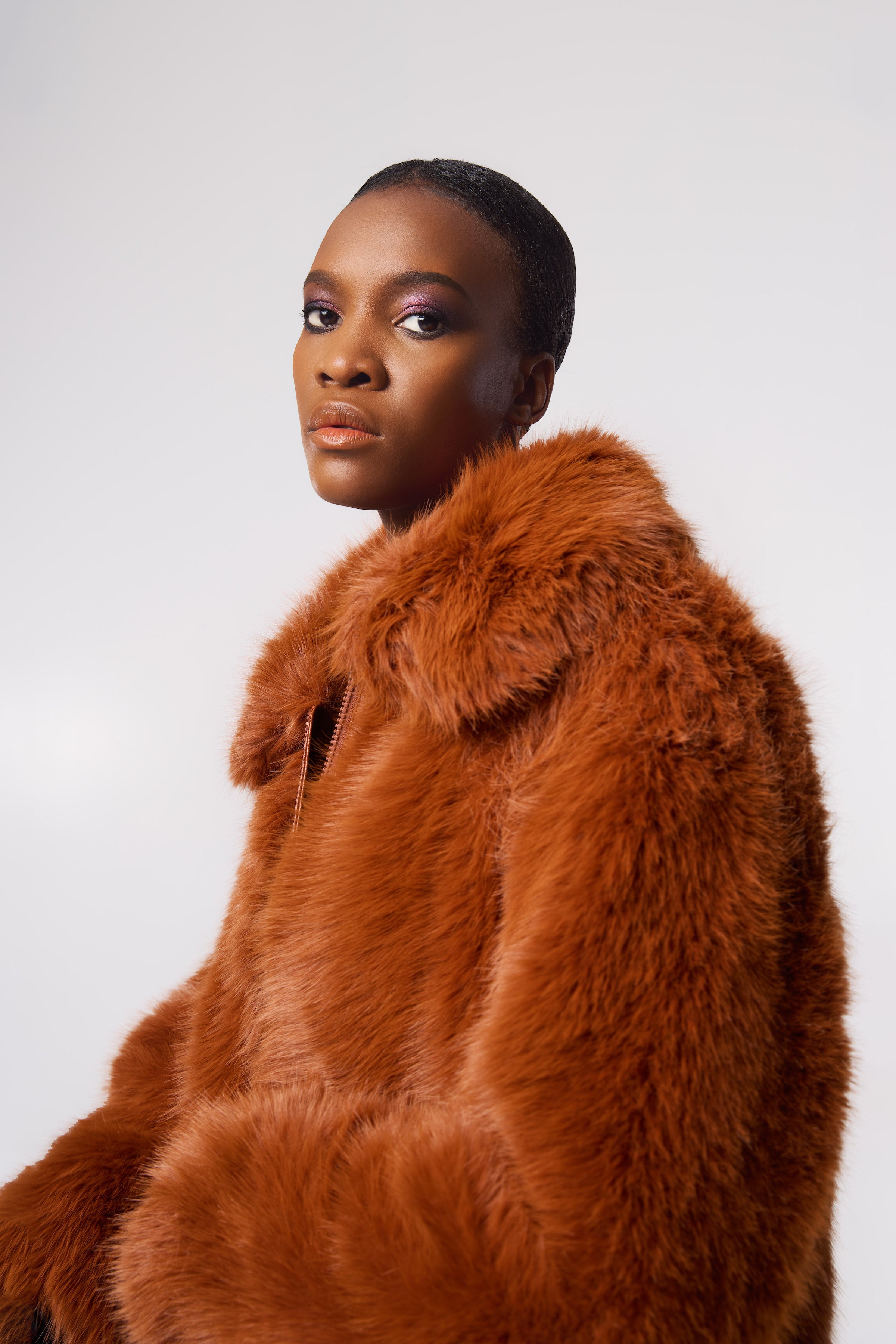 KELLY coat in Rust — plush cruelty-free faux fur with oversized collar for confident cold-weather style.