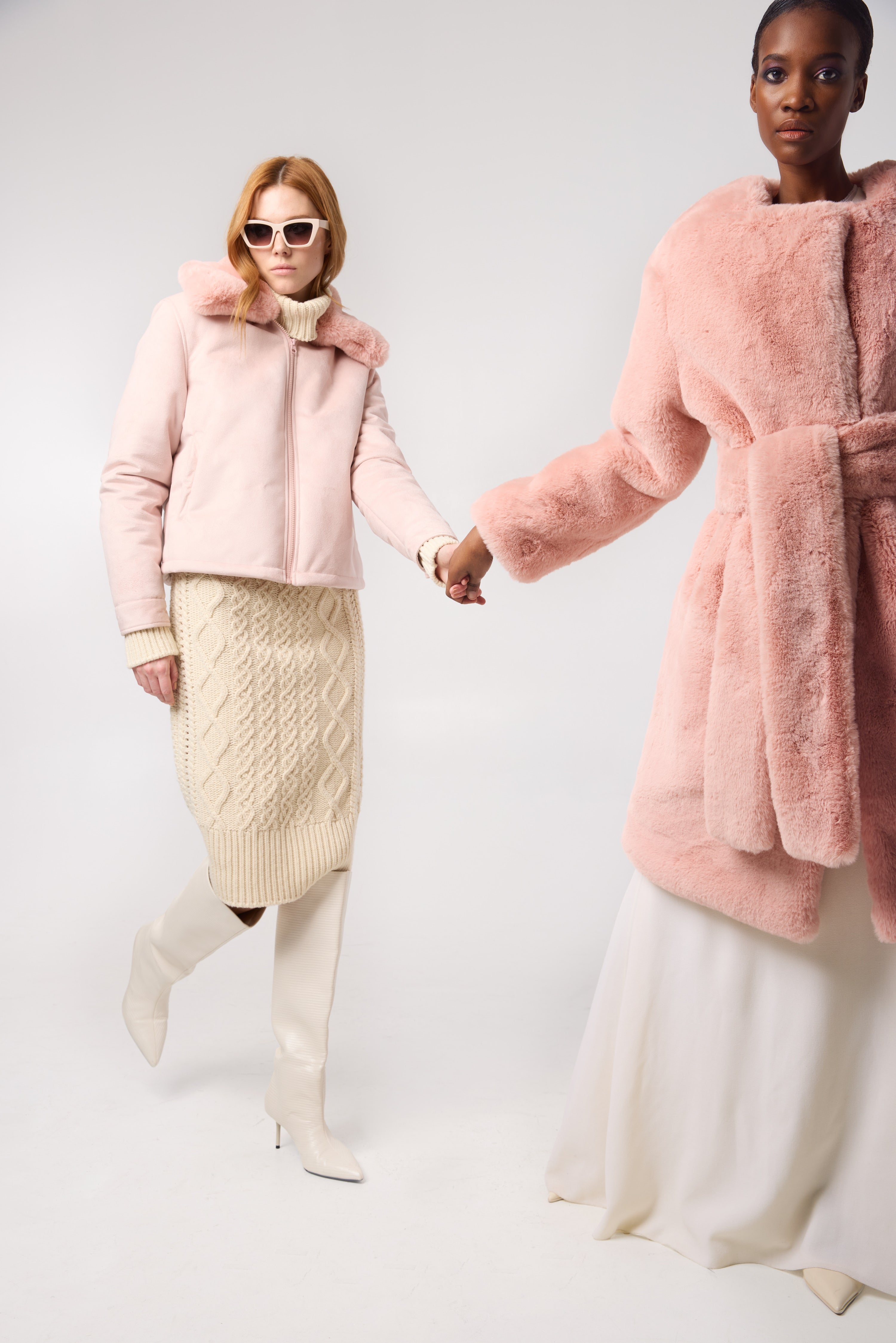 Detail shot — close-up of the LUNA coat in Flamingo, emphasizing the rich faux fur texture and bold colour.