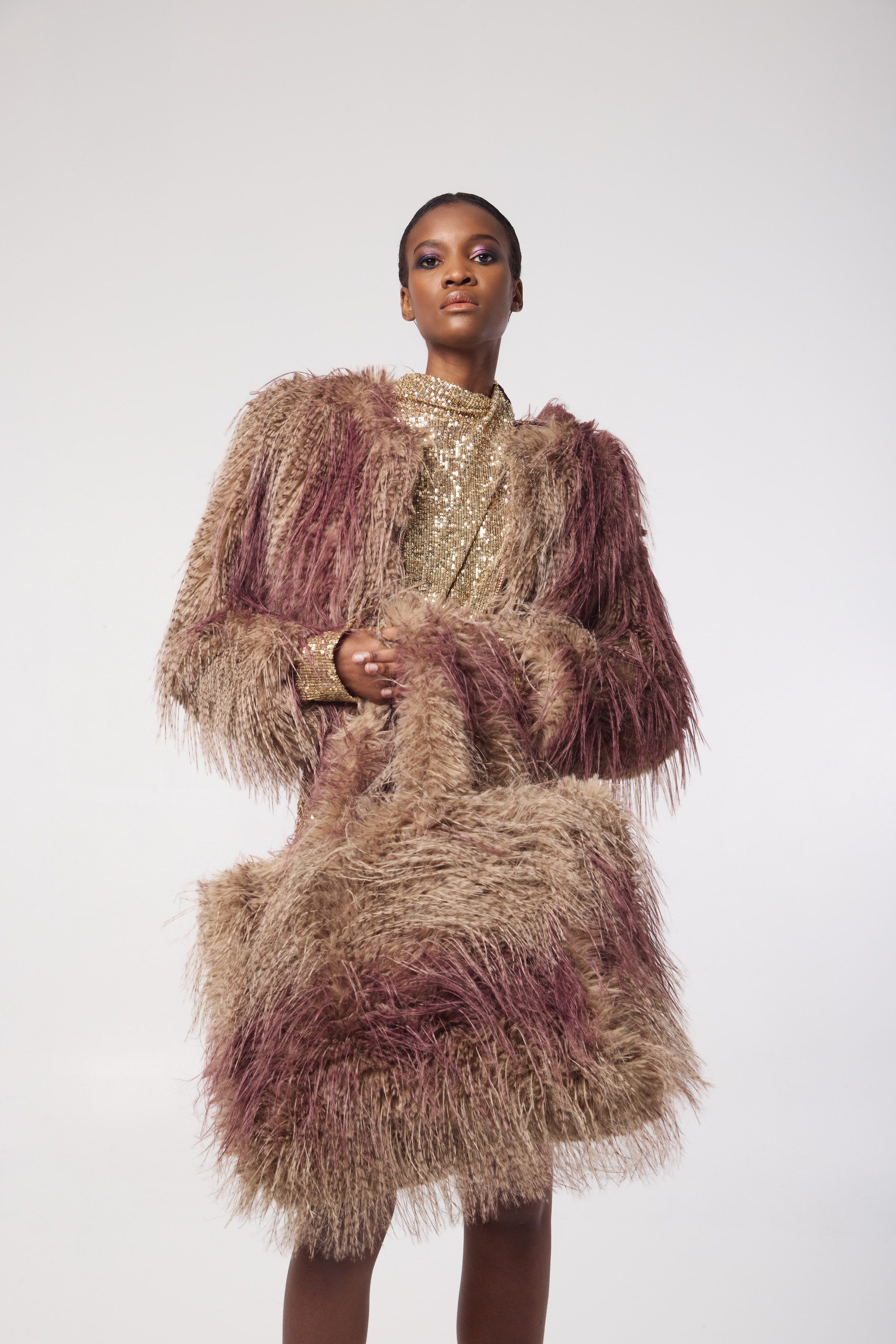 ANNA jacket in Ostrich — styled in an editorial shot to highlight bold texture, cropped silhouette, and luxe feel. Paired with matching oversized tote bag.