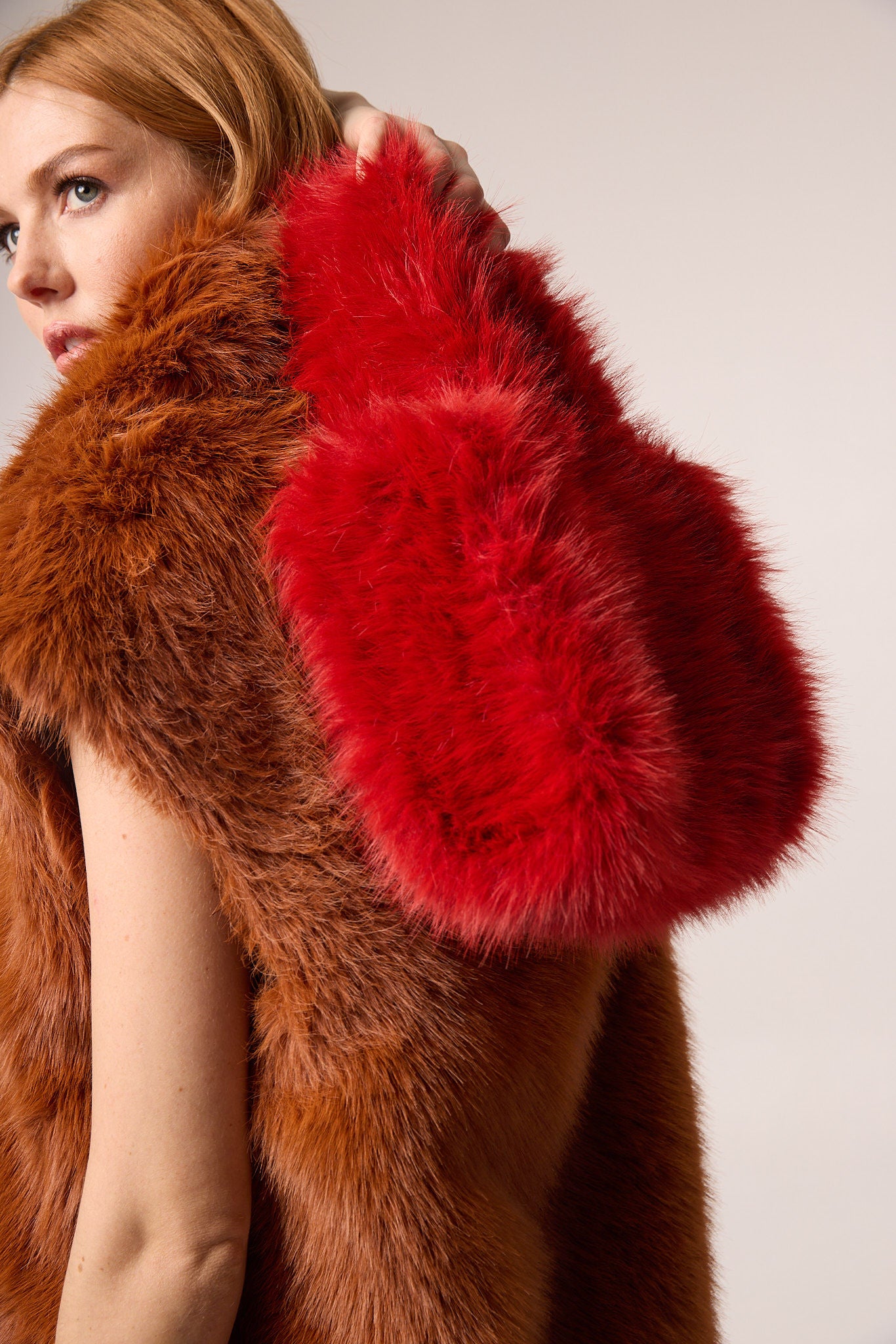 Detail shot — close-up of the Mini Tote in Red, emphasizing the rich texture and quality craftsmanship of the faux fur material.