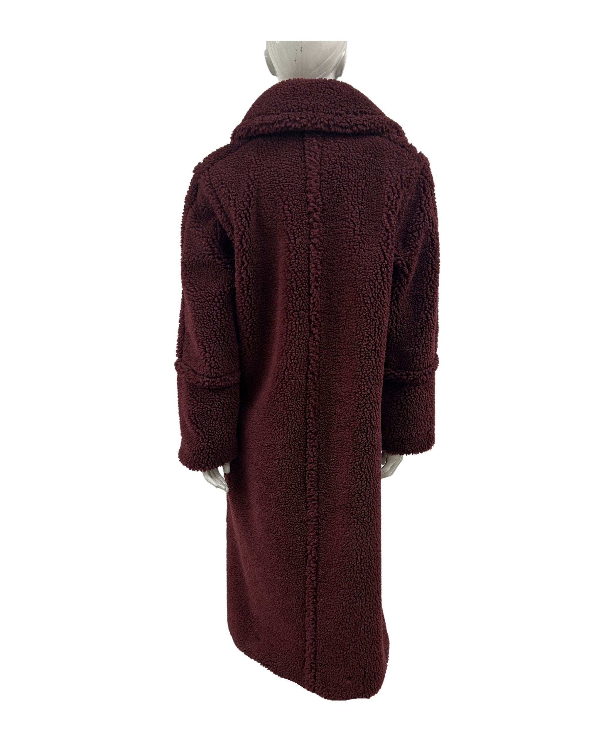 Cranberry teddy coat on a mannequin against a white background