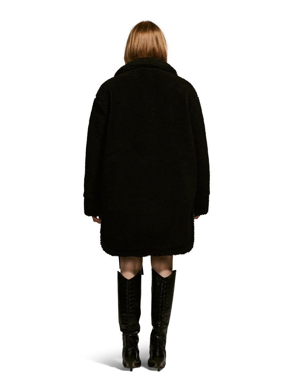 Model wearing the Ash, a teddy-inspired faux-fur sherpa shell with a laid-back silhouette in Charcoal.