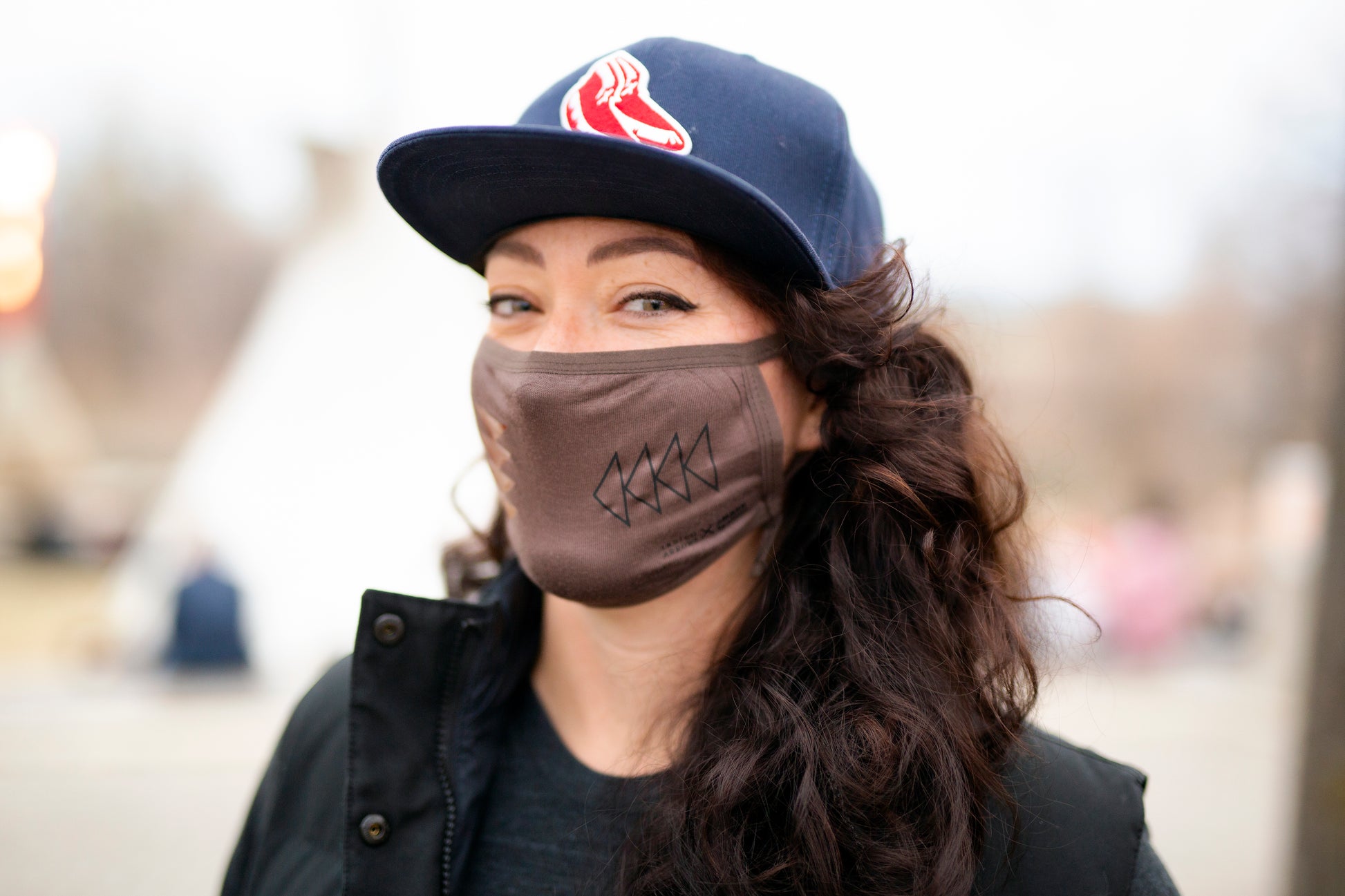 Made in Canada beige adult breathable face mask with Indigenous design.