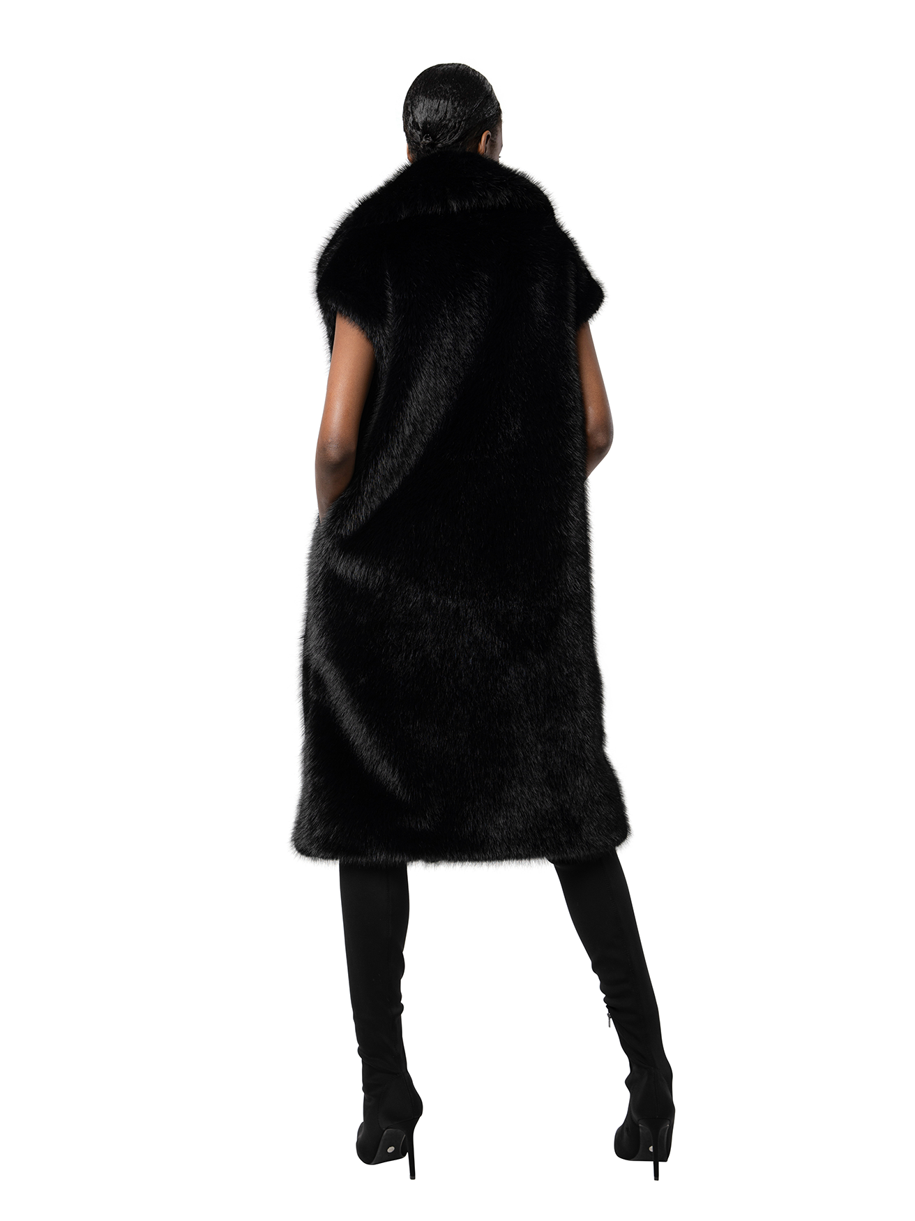 Back view — KIT coat in Ink Black seen from behind, showcasing the smooth texture and streamlined shape in deep black tones.
