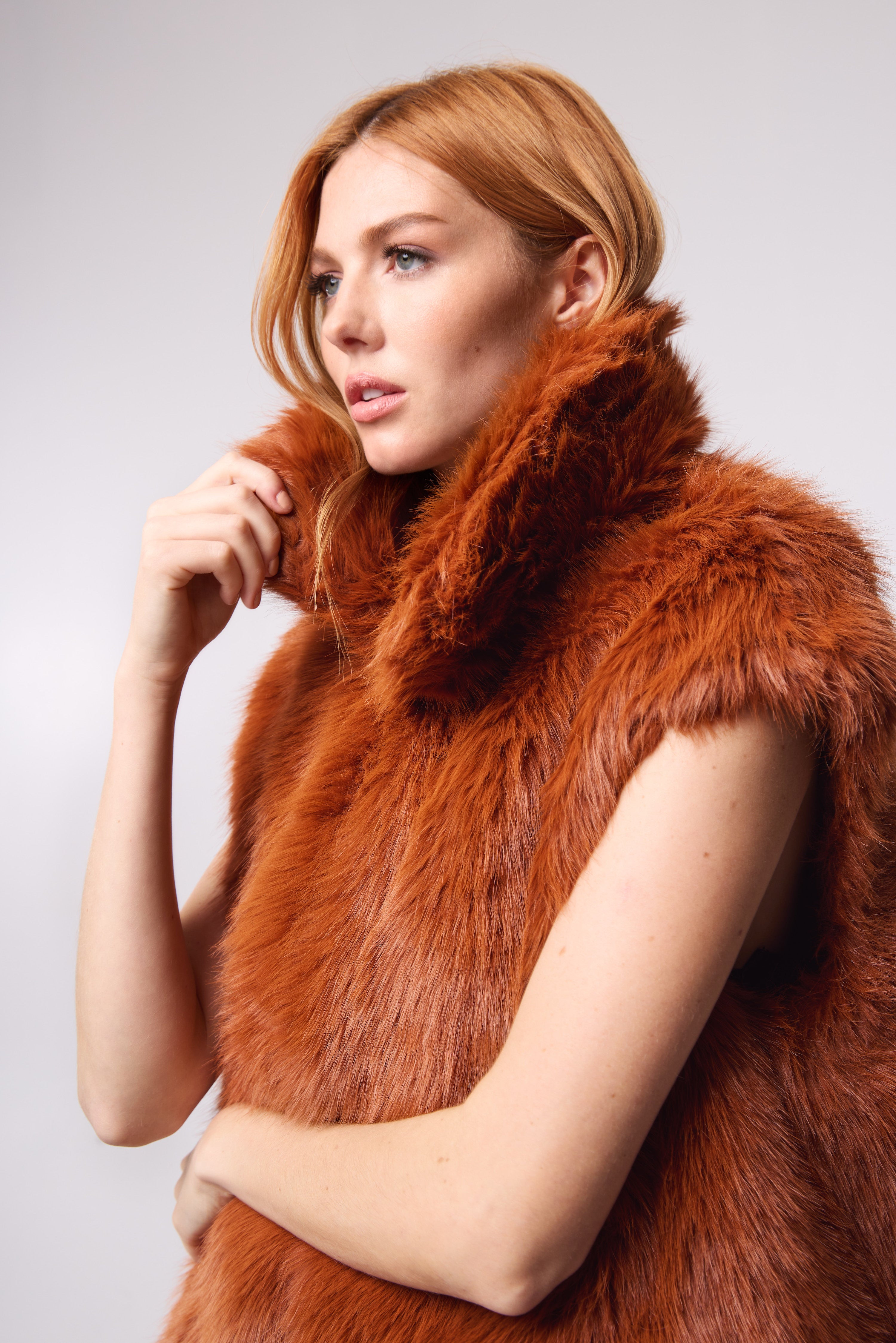 Editorial shot — MIA in Rust close up shot, emphasizing the plush faux fur texture and rich autumnal hue.
