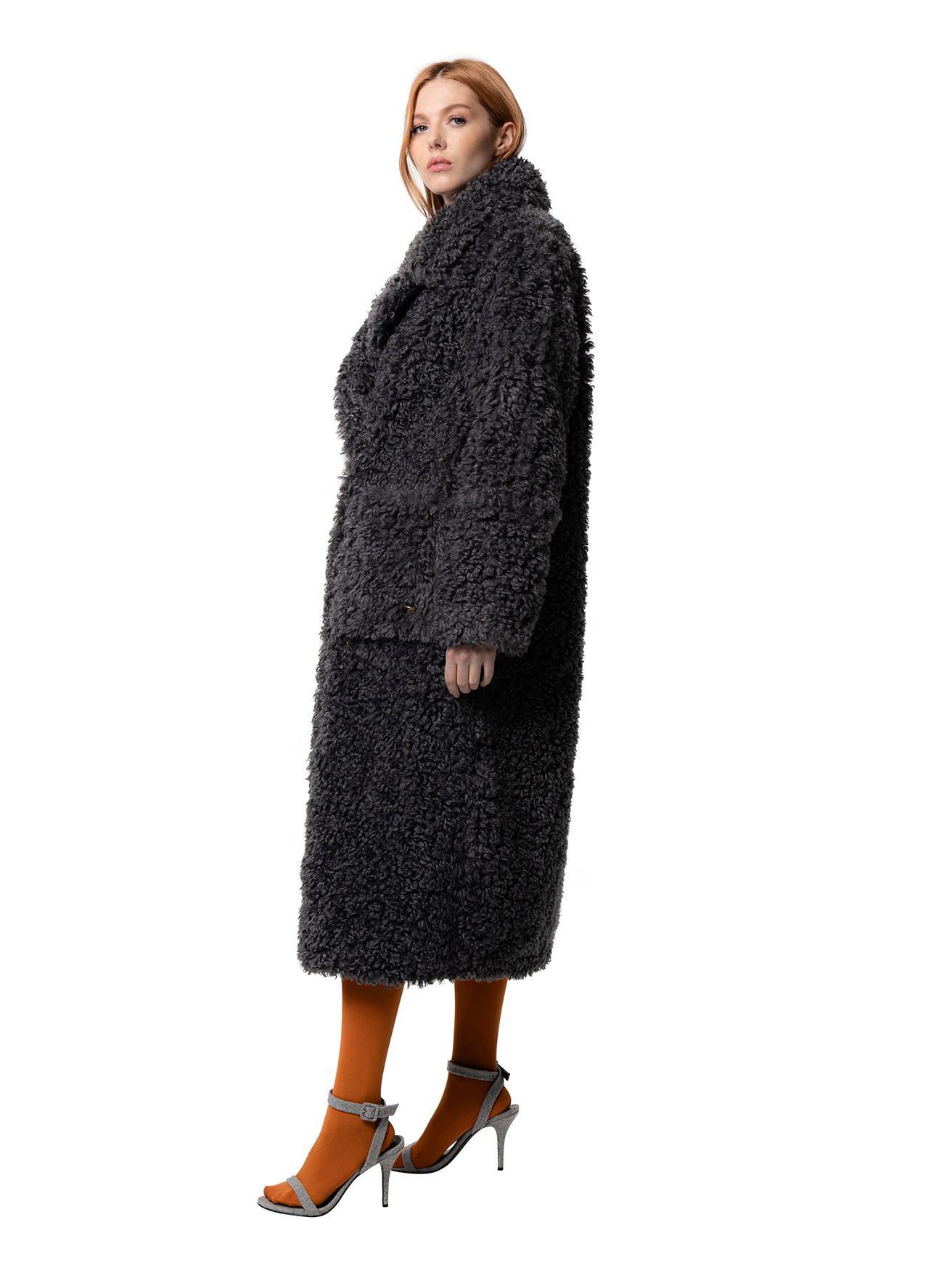 Side view — RUE in Shadow shown from the side, highlighting the smooth cruelty-free faux fur and tailored fit.