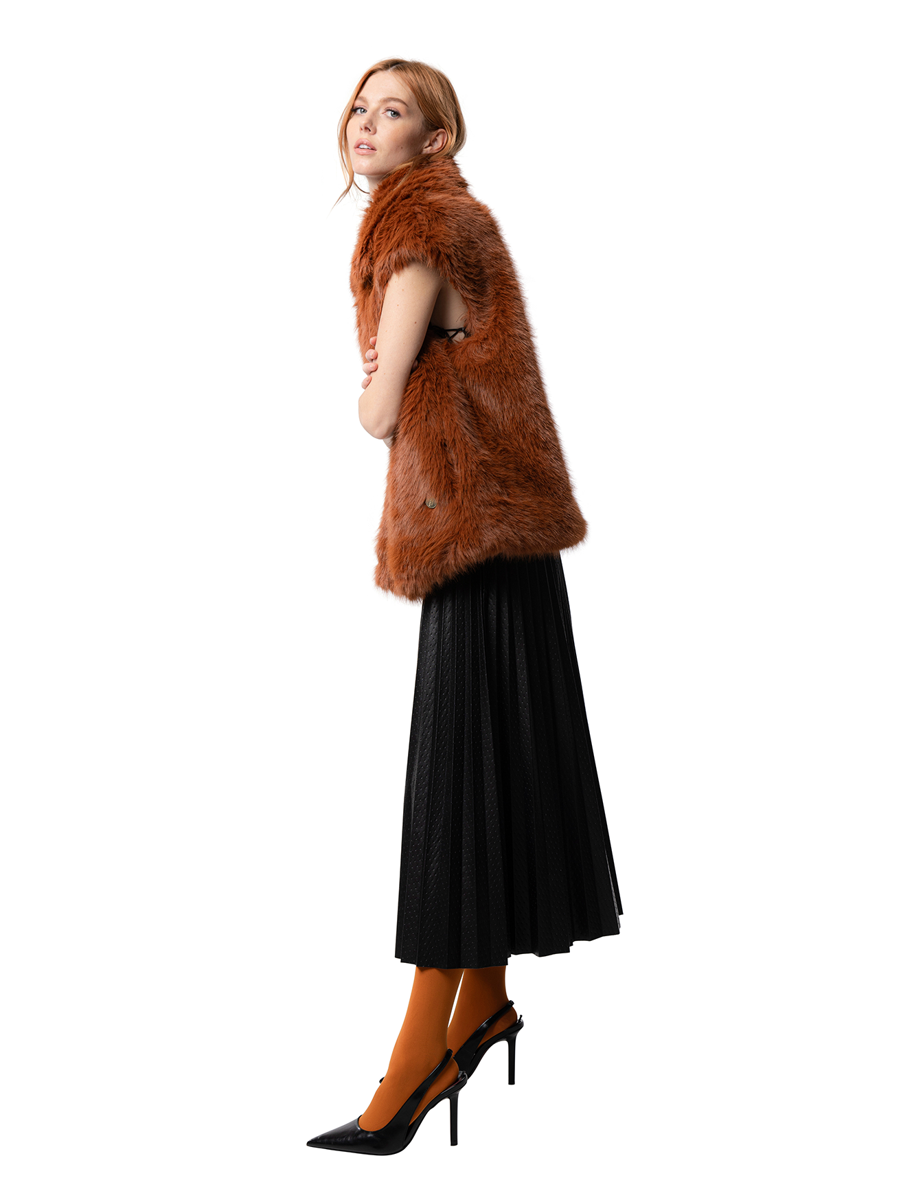 Side view — MIA coat in Rust shown from the side, highlighting the relaxed drape and structured yet soft shape of the faux fur outerwear.