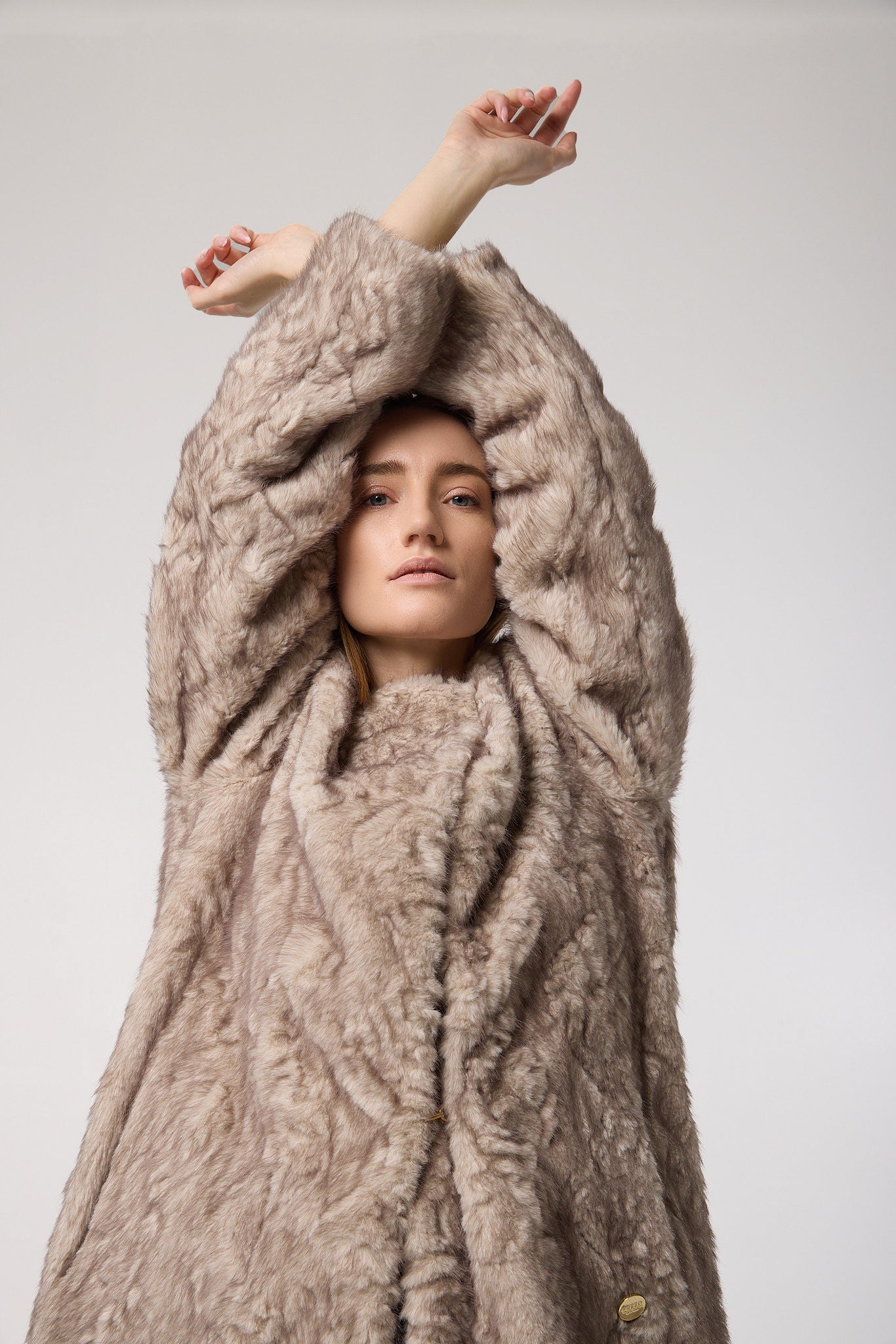 Editorial shot — STELLA in Husky styled editorially, layered over winter neutrals to elevate the elegant shape and luxurious faux fur texture.