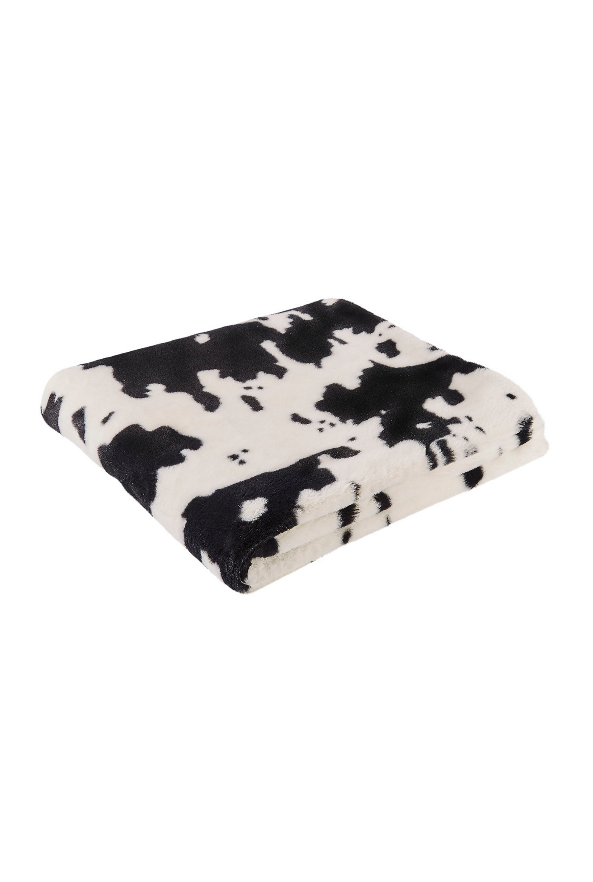 Faux fur throw blanket in black and white cow.