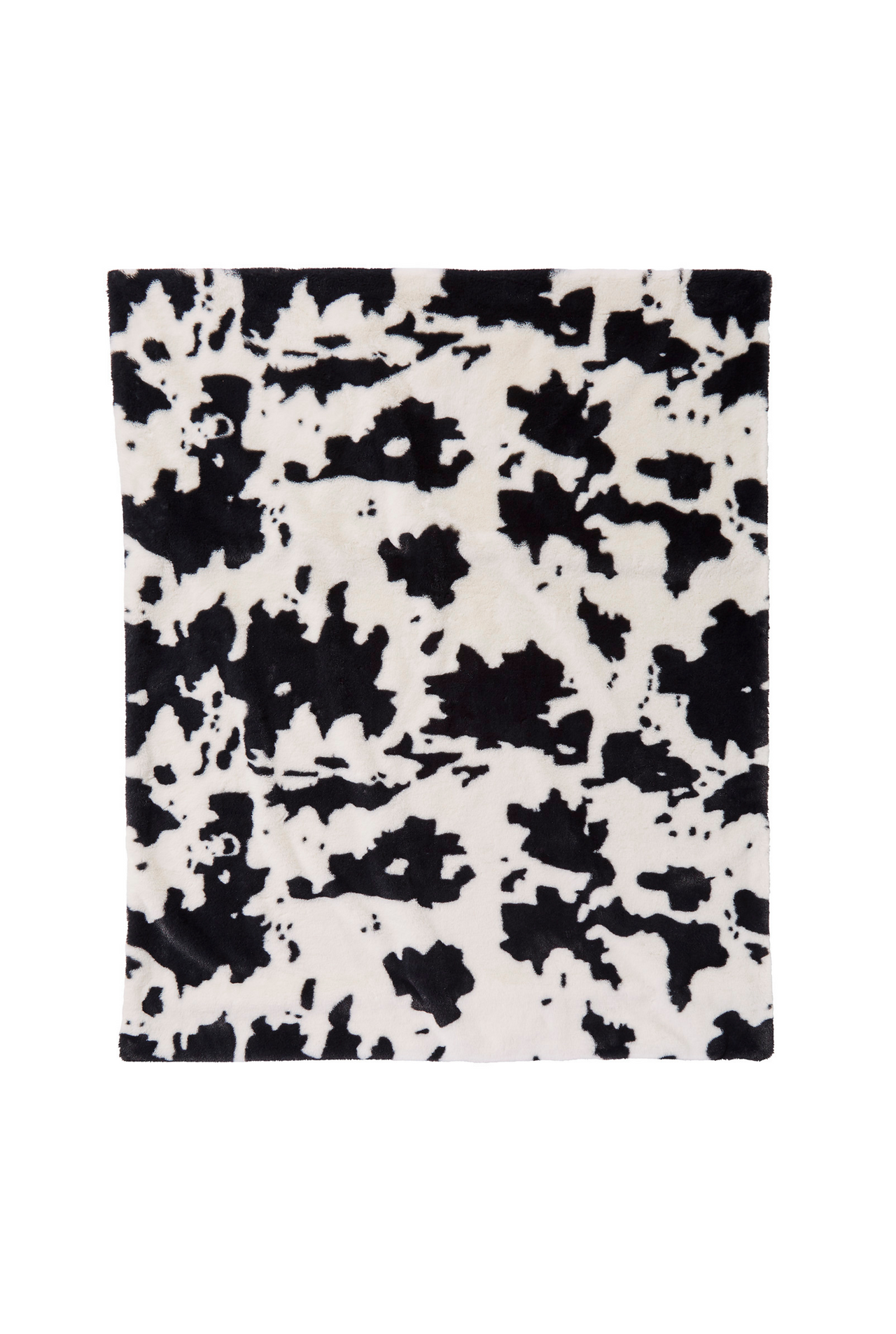 Faux fur throw blanket in black and white cow.