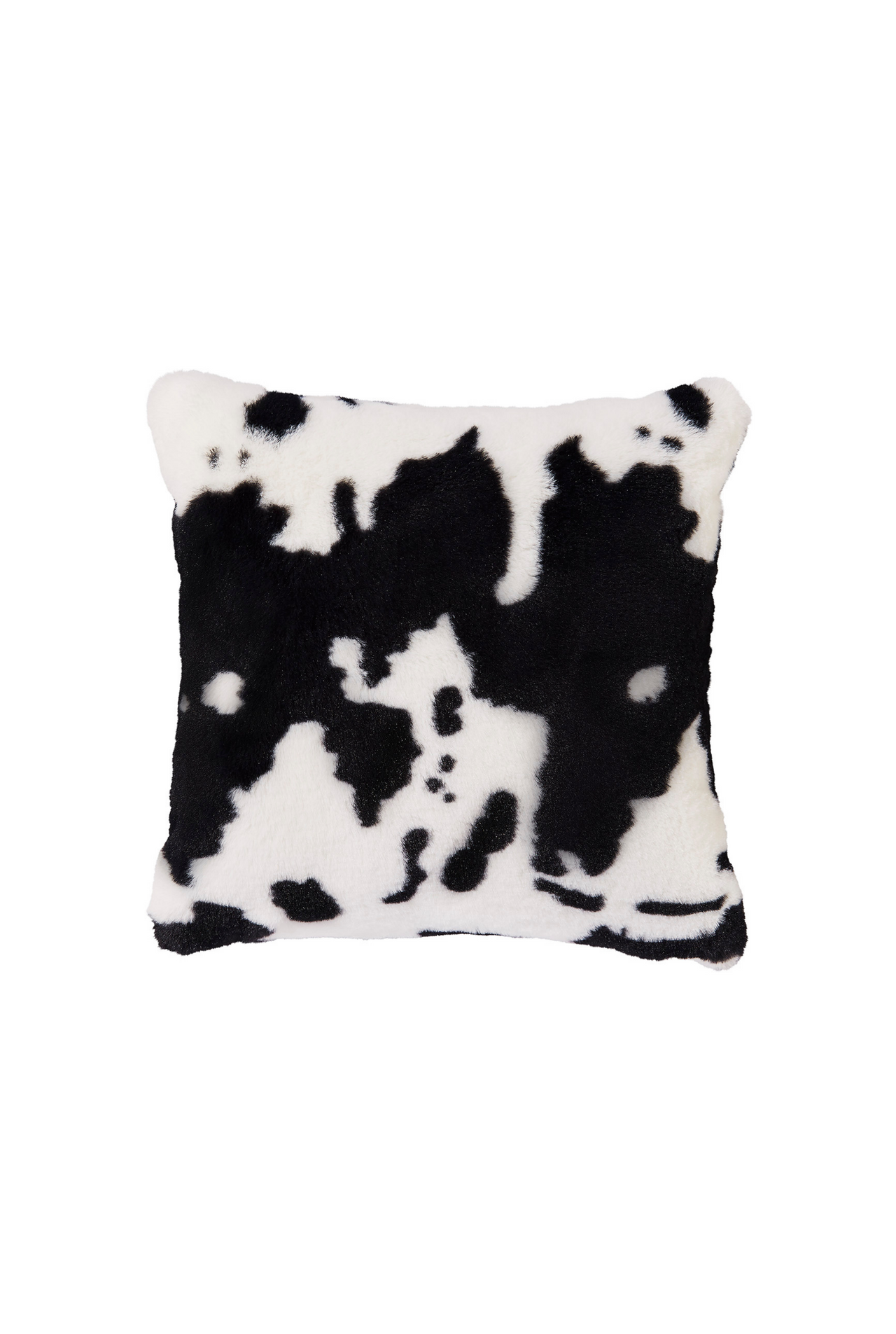 Faux fur throw pillow in black and white cow print.