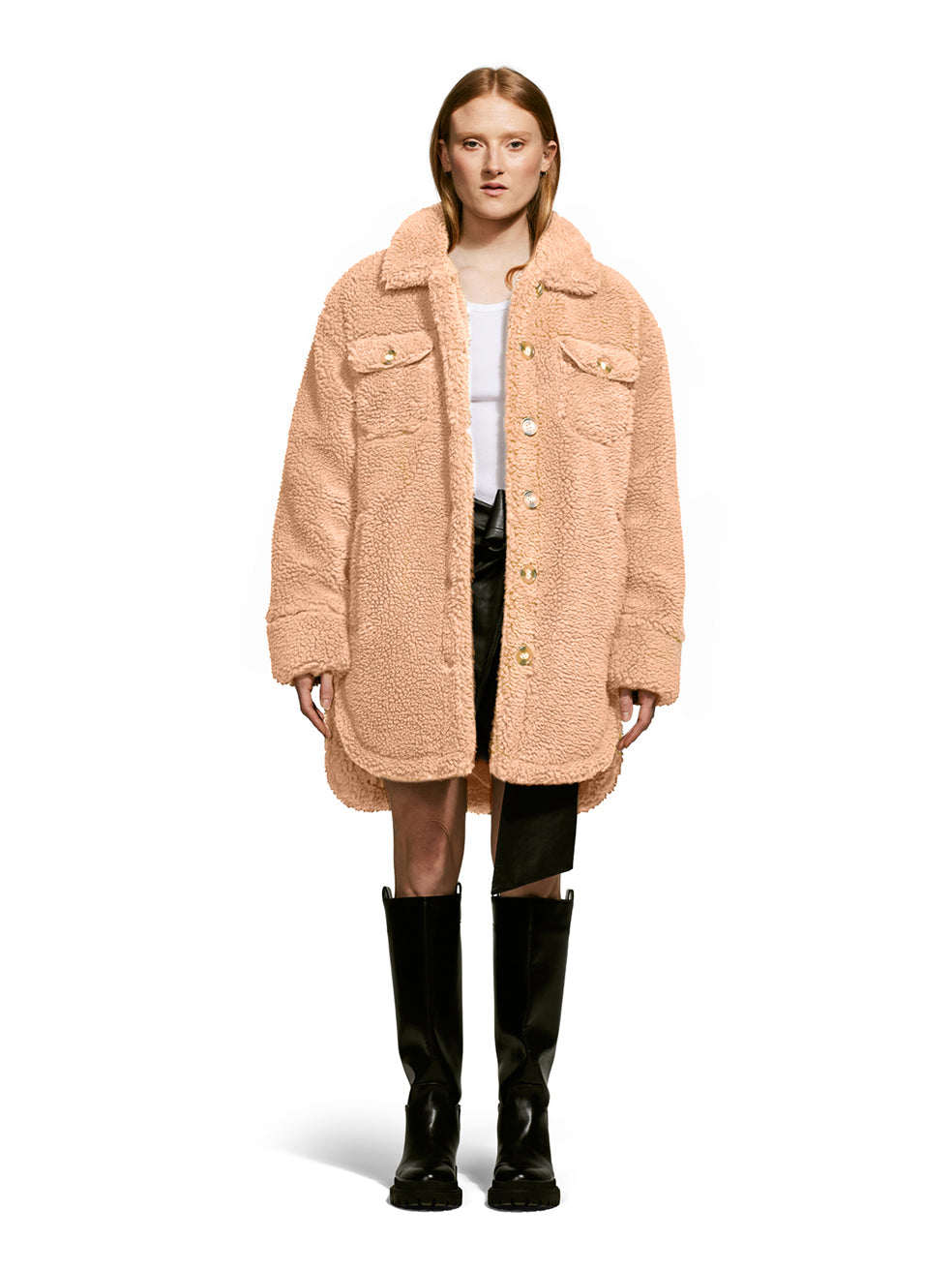 Model wearing the Ash, a teddy-inspired faux-fur sherpa shell with a laid-back silhouette in Camel.